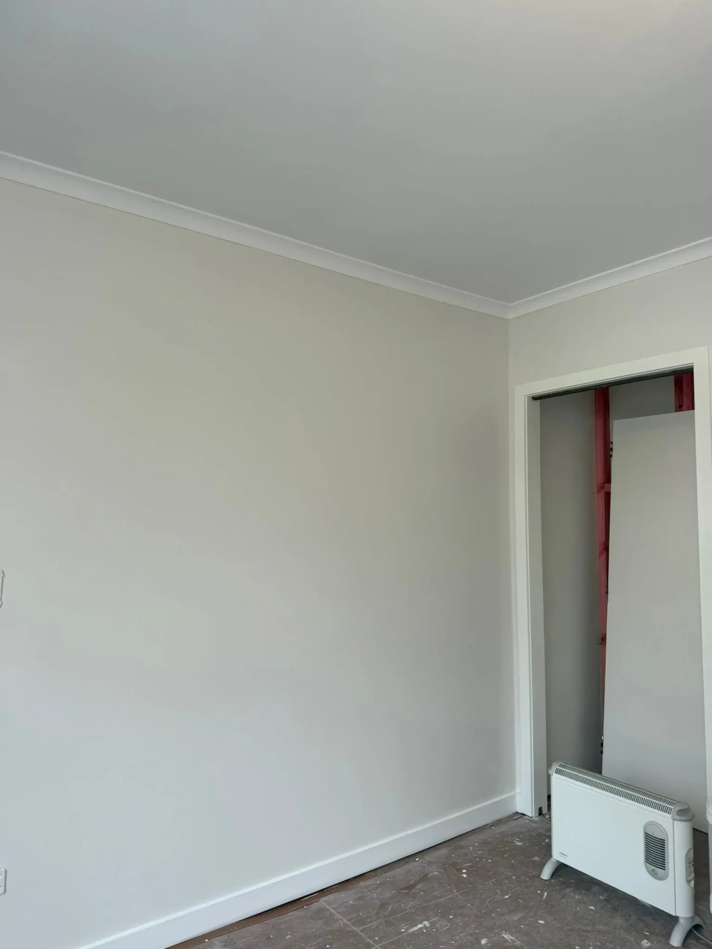 Smooth repainted interior wall with neat sliding door reveal