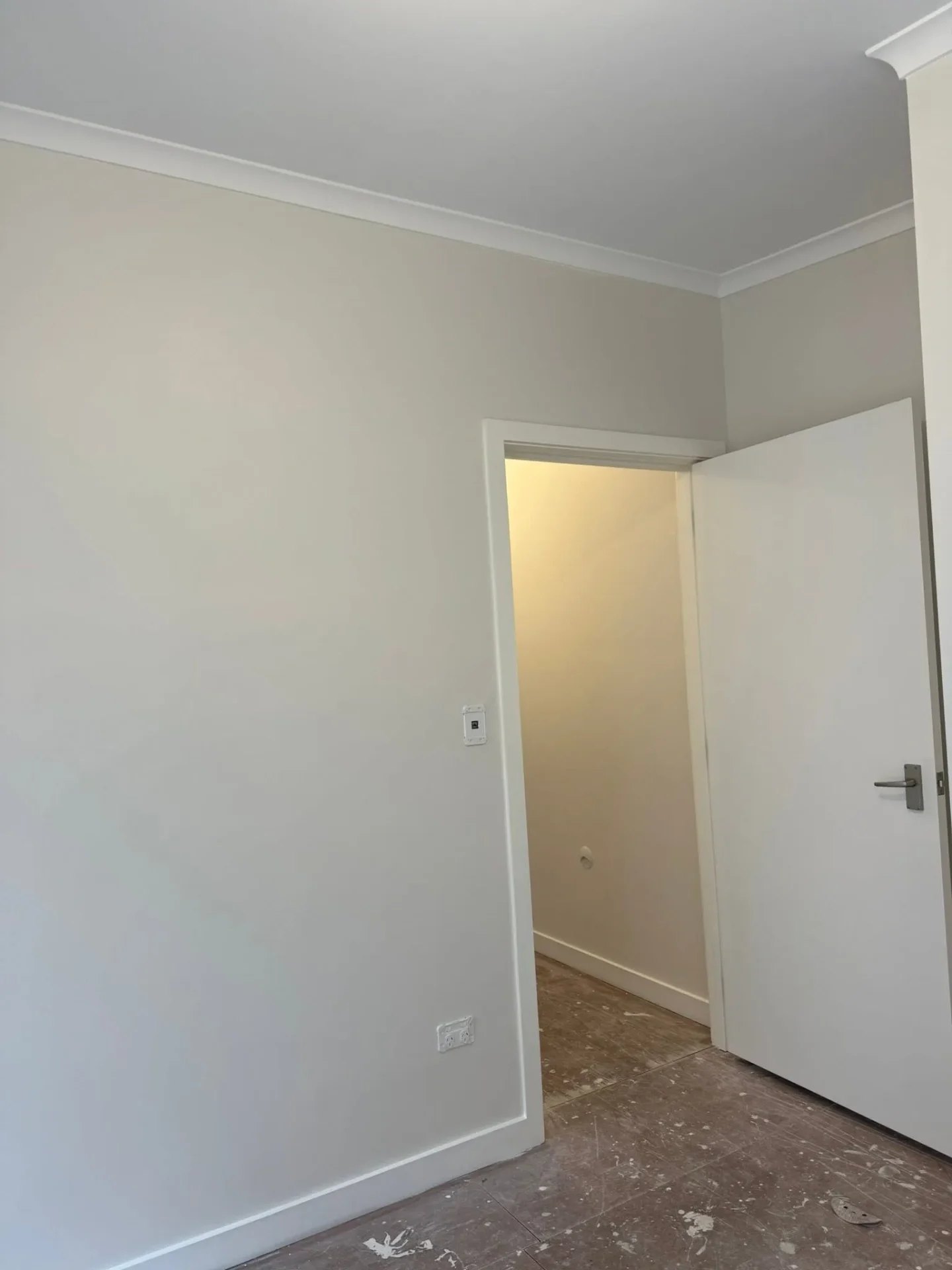 Bright interior repaint with neat doorway and skirting